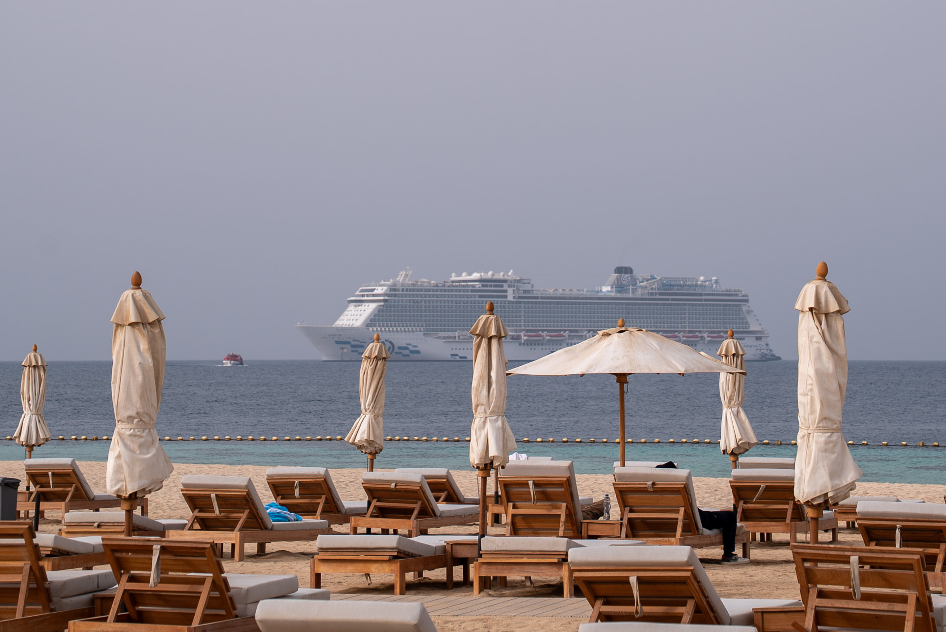 Ship on the horizon from the beach club — Gabriel Moura broadcast and video work