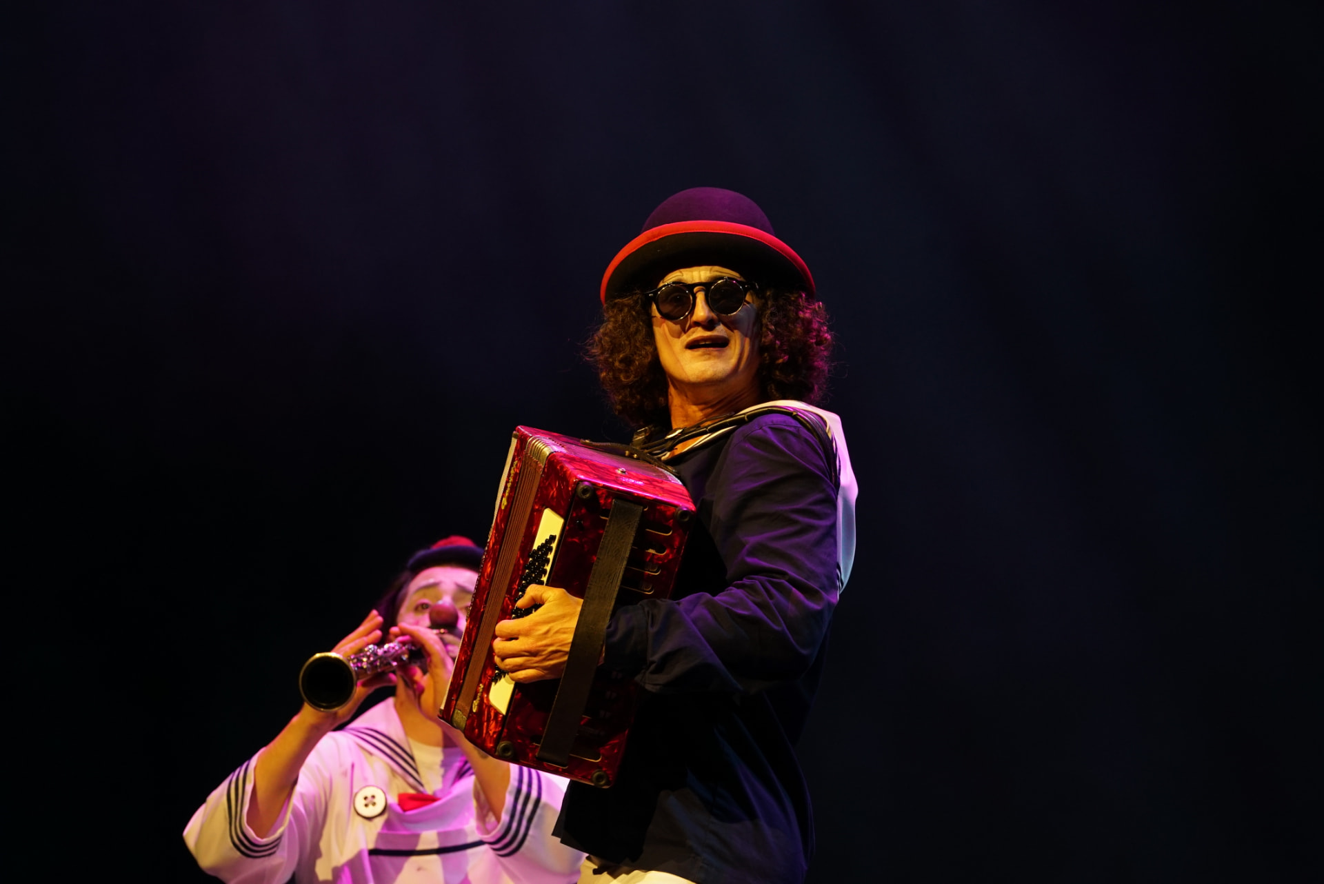 Accordion act under stage light
